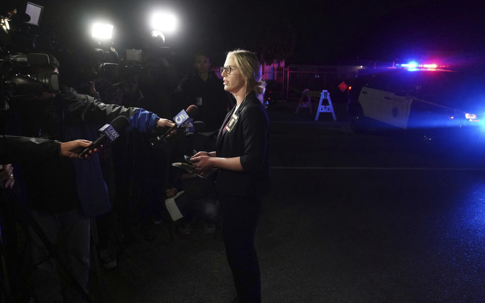 Long Beach Police PIO Jennifer De Prez gives information at the scene of a shooting in Long Beach on Wednesday, Oct. 30, 2019. Authorities say three people were fatally shot and nine others injured at a home in Long Beach, California.(Scott Varley/The Orange County Register via AP)