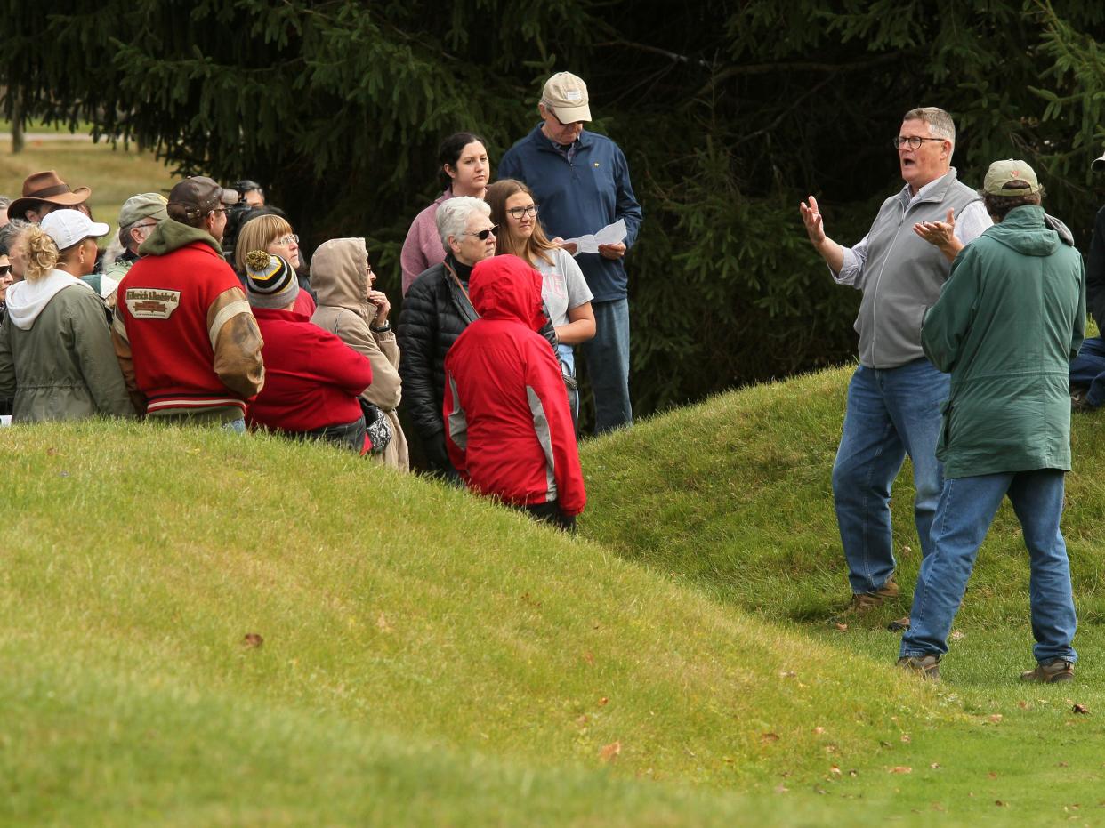 Jeff Gill, a volunteer, gives a tour of the Octagon Earthworks on Oct. 15. The Ohio History Connection held events at the Great Circle and Octagon Earthworks to celebrate their designation as UNESCO World Heritage Sites.