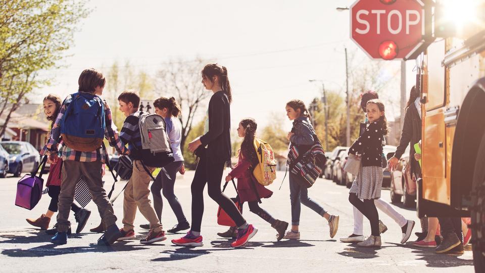 School kids crossing street.