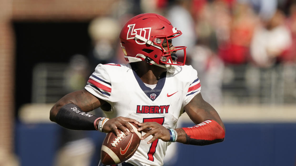 Liberty quarterback Malik Willis (7) passes against Mississippi during the first half of an NCAA college football game in Oxford, Miss., Saturday, Nov. 6, 2021. Mississippi won 27-14. (AP Photo/Rogelio V. Solis)