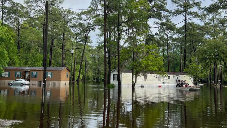 Floodwaters inundate a neighborhood as first responders rescue residents trapped in a mobile home in Tallahassee, Florida, Thursday morning. - Leon County Sheriff's Office