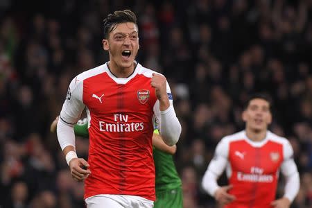 Britain Football Soccer - Arsenal v PFC Ludogorets Razgrad - UEFA Champions League Group Stage - Group A - Emirates Stadium, London, England - 19/10/16 Arsenal's Mesut Ozil celebrates scoring their sixth goal and his hat trick Reuters / Toby Melville Livepic