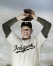 FILE - This is a March 1951, file photo showing Brooklyn Dodgers pitcher Don Newcombe. Newcombe, the hard-throwing Brooklyn Dodgers pitcher who was one of the first black players in the major leagues and who went on to win the rookie of the year, Most Valuable Player and Cy Young awards, died Feb 19, 2019. He was 92. (AP Photo/File)