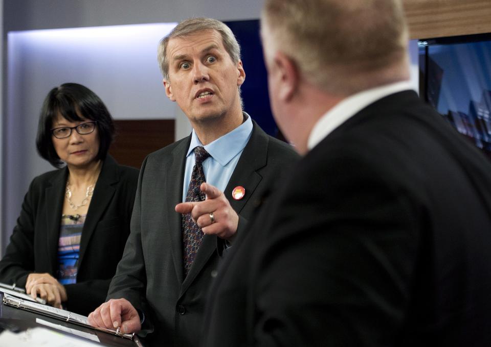 Olivia Chow, left, David Soknacki, center, challenge Rob Ford as they take part in a live television mayoral debate in Toronto on Wednesday, March 26, 2014. (AP Photo/The Canadian Press, Nathan Denette)