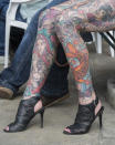 <p>A woman’s legs at the London Tattoo convention at Tobacco Dock on Sept. 23, 2017 in London, England. (Photo: James D. Morgan/Getty Images) </p>