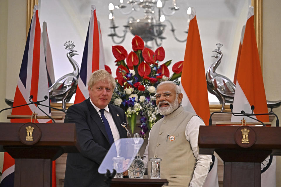 India's Prime Minister Narendra Modi, right, shakes hands with his British counterpart Boris Johnson after a joint press conference at Hyderabad House in New Delhi, Friday, April 22, 2022. (Ben Stansall/Pool Photo via AP)