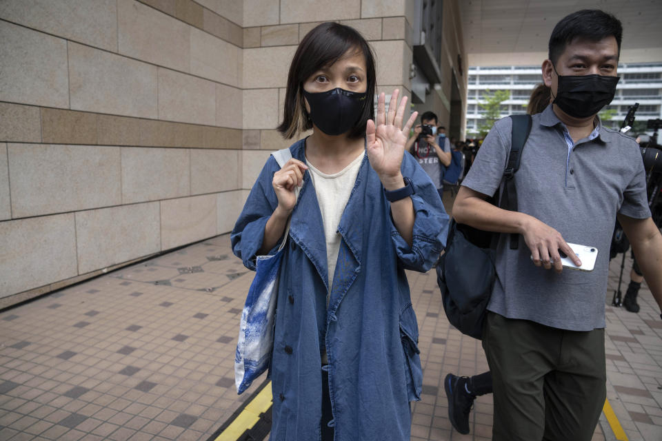 FILE - In this June 19. 2021, file photo, Chan Pui-man, left, associate publisher of Apple Daily newspaper, and Lam Man-chung, right, executive editor-in-chief walk out from court in Hong Kong. Hong Kong police charged two top editors and two editorial writers at Apple Daily with collusion weeks after the city's largest pro-democracy newspaper was forced to cease publication and its assets were frozen. All four were charged with conspiring to "collude with a foreign country or with external elements to endanger national security" under the city's year-old national security law and appeared in court Thursday, July 22, 2021. (AP Photo/Kin Cheung)