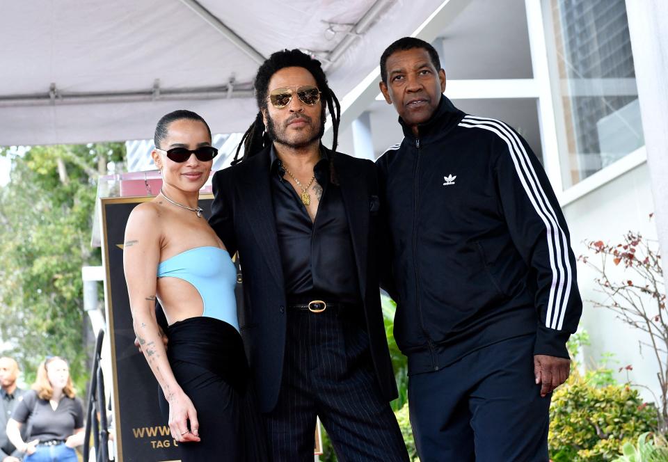 Kravitz, from left, Lenny Kravitz and actor Denzel Washington pose together at the Hollywood Walk of Fame ceremony honoring Lenny.