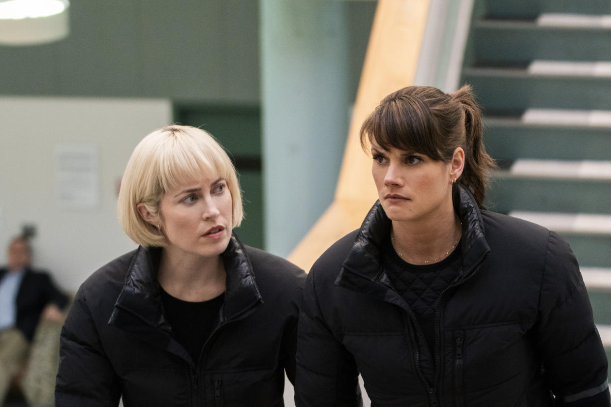 Charlotte Sullivan and Missy Peregrym, both in black.