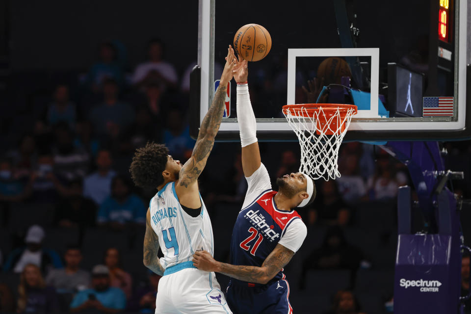 Washington Wizards center Daniel Gafford (21) blocks the shot of Charlotte Hornets center Nick Richards (4) during the first half of an NBA basketball game in Charlotte, N.C., Wednesday, Nov. 8, 2023. (AP Photo/Nell Redmond)