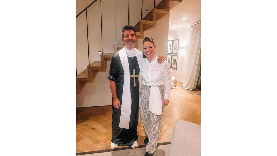 Simon Cowell in a priest outfit with Lucy Spraggan