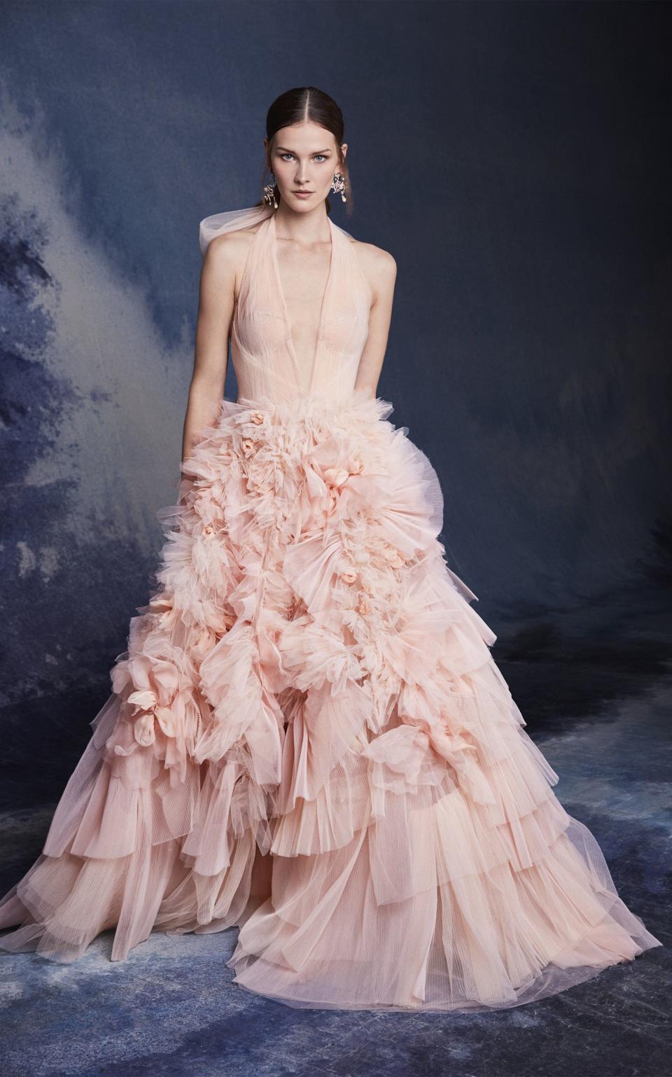 <p><strong>Marchesa</strong></p><p>modaoperandi.com</p><p><strong>$7995.00</strong></p><p><a href="https://go.redirectingat.com?id=74968X1596630&url=https%3A%2F%2Fwww.modaoperandi.com%2Fmarchesa-fw20%2Ftextured-ruffled-tulle-gown&sref=https%3A%2F%2Fwww.harpersbazaar.com%2Fwedding%2Fbridal-fashion%2Fg33561630%2Fpink-blush-wedding-dresses%2F" rel="nofollow noopener" target="_blank" data-ylk="slk:SHOP NOW;elm:context_link;itc:0;sec:content-canvas" class="link ">SHOP NOW</a></p><p>Large doses drama in the form of ruffles, tiers, and lots of tulle feel over-the-top in all the best ways. A plunging neckline adds a dose of sex appeal to an otherwise romantic look, and this ruffled ball skirt feels undeniably glamorous. Essentially, this look is all about the bridal basics—but in blush, it feels that much more feminine, flirty, and fashion-forward.<br></p>