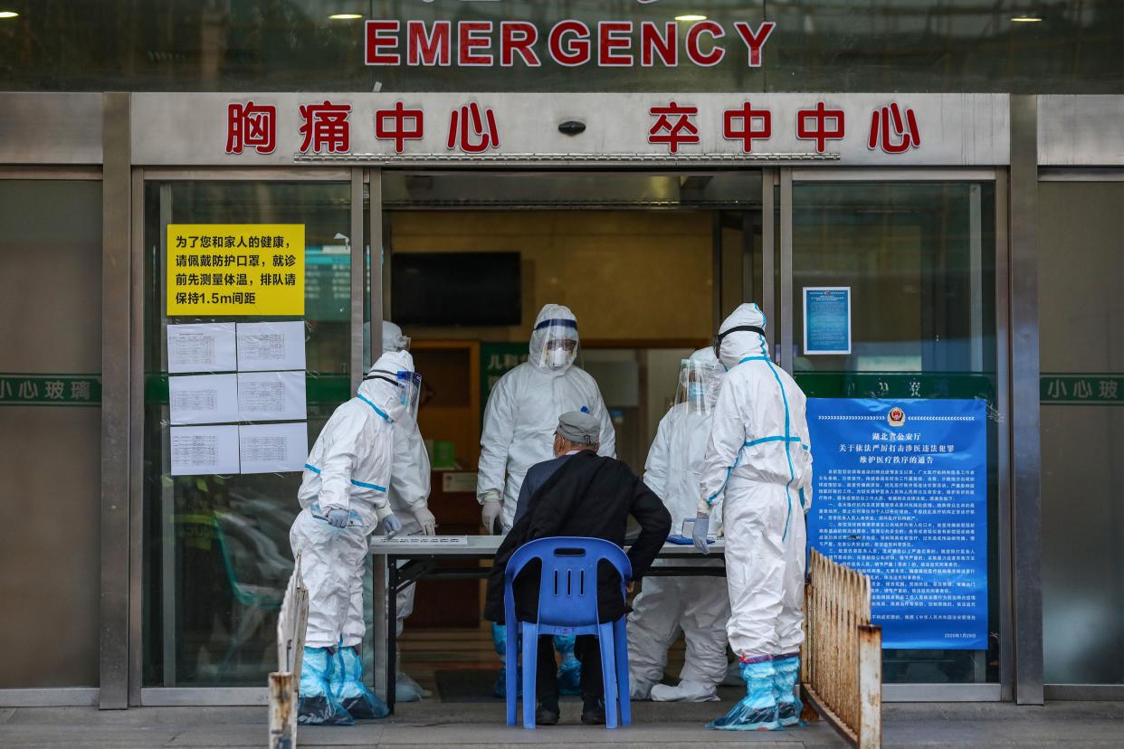 This photo taken on March 4, 2020 shows a man visiting a hospital in Wuhan in China's central Hubei province. - China on March 5 reported 31 more deaths from the new coronavirus epidemic, taking the country's overall toll past 3,000, with the number of new infections slightly increasing. (Photo by STR / AFP) / China OUT (Photo by STR/AFP via Getty Images)