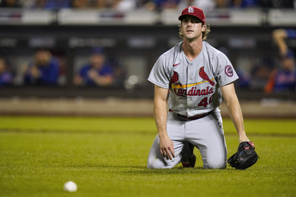 St. Louis Cardinals starting pitcher Jake Woodford reacts to an RBI bunt single by New York Mets' Javier Baez during the first inning of a baseball game Tuesday, Sept. 14, 2021, in New York. (AP Photo/Frank Franklin II)