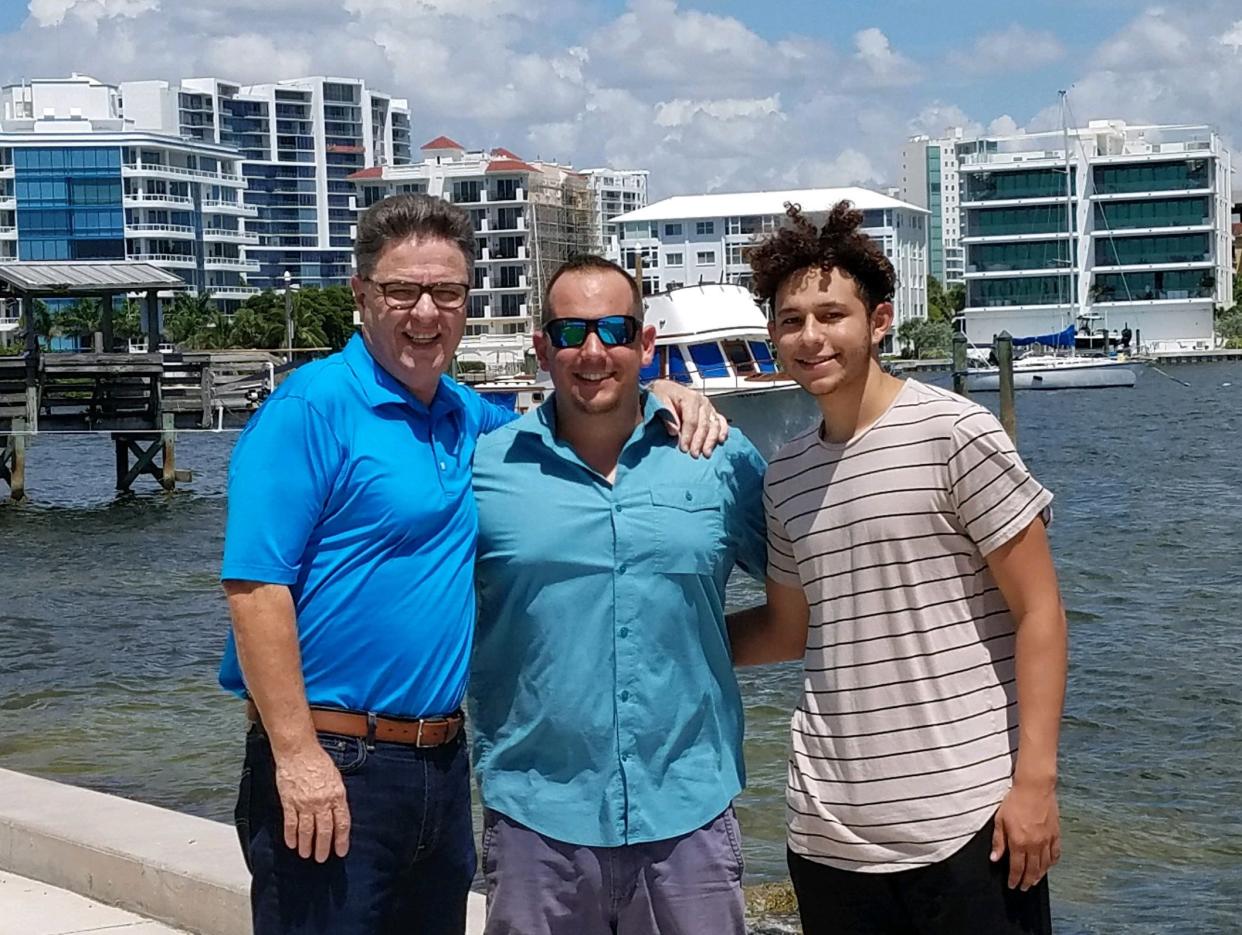 Longtime Big Brother Rich Puckett, left, with his son, Jason Puckett and Jason’s Little Brother Andrew. “Being a mentor may not change the world, but it will change the world of the child you mentor," Rich Puckett said.