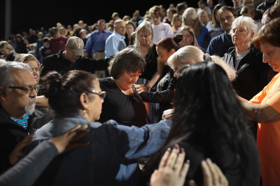 <p>Guests attend a prayer services at the La Vernia High School Football stadium to grieve the 26 victims killed at the First Baptist Church of Sutherland Springs on Nov. 7, 2017 in La Vernia, Texas. (Photo: Scott Olson/Getty Images) </p>