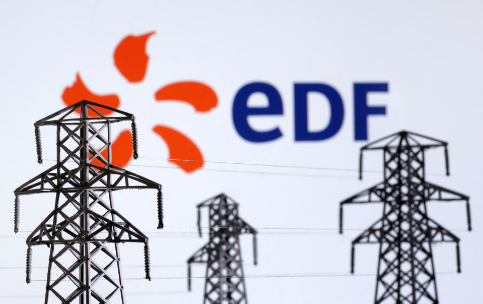 Electric power transmission pylon miniatures and EDF (Electricite de France) logo are seen in this illustration taken, December 9, 2022. REUTERS/Dado Ruvic/Illustration