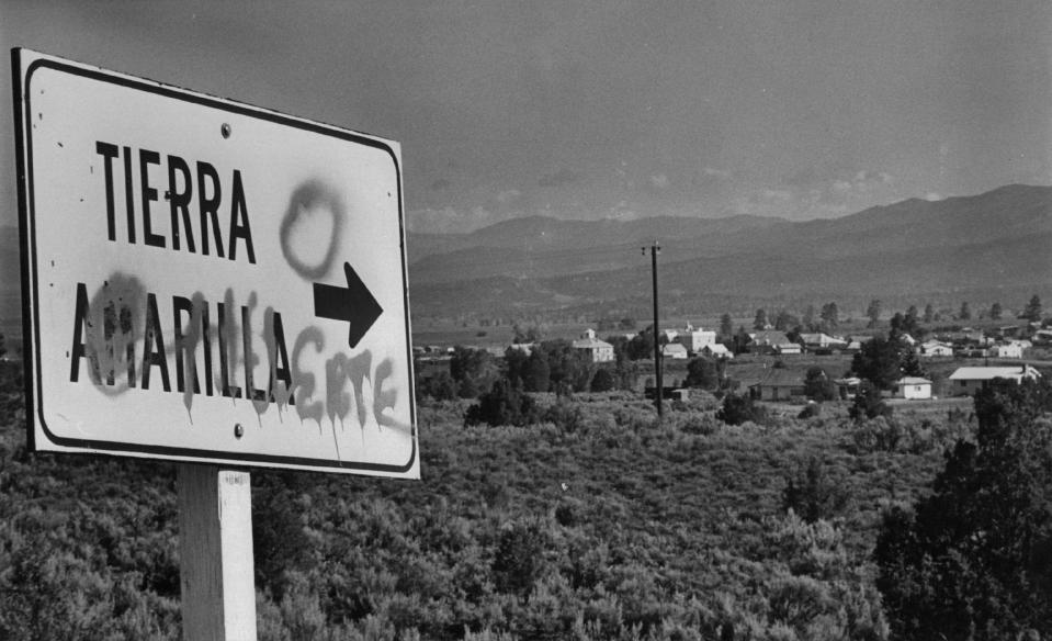 The road sign marking Tierra Amarilla, N.M., has been changed to read Tierra O Muerte, land or death, in the continuing land grant struggle. 1976.