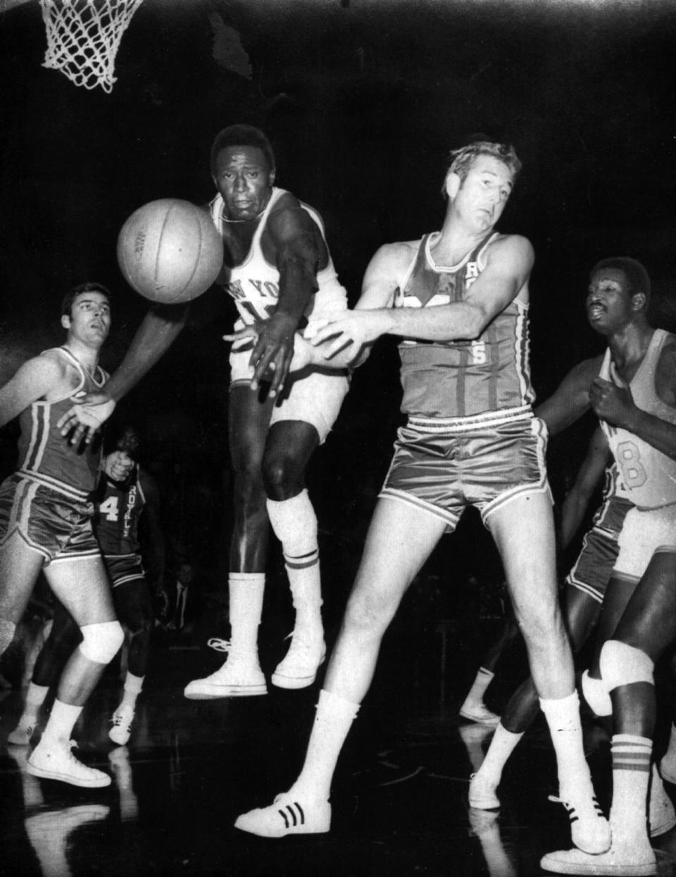 OCTOBER 27, 1968: Floating Reed: Willis Reed of the New York Knicks appears to be floating as he and Cincinnati's Connie Dierking (No. 24) try  for a loose ball in the first quarter of their NBA game at Madison Square Garden Saturday, 10/26/68, night. At left is Royals' Jerry Lucas (No. 16) and at right is Walt Bellamy of the Knicks (No. 8). The Knicks won, 98-92.