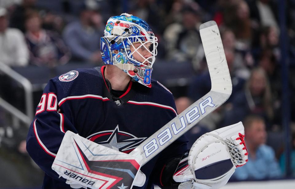 Columbus Blue Jackets goaltender Elvis Merzlikins (90) looks down ice during the second period of the NHL game against the Tampa Bay Lightning at Nationwide Arena in Columbus on April 28, 2022.