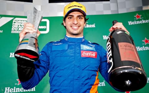 Carlos Sainz of Spain and McLaren F1 celebrates after later being awarded third place in the F1 Grand Prix of Brazil at Autodromo Jose Carlos Pace on November 17, 2019 in Sao Paulo, Brazil - Credit: Getty Images