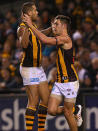 Lance Franklin and Jack Gunston of the Hawks celebrate a goal during the round 12 AFL match between the Carlton Blues and the Hawthorn Hawks at Etihad Stadium on June 14, 2013 in Melbourne, Australia.