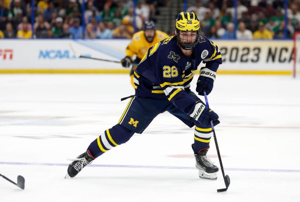 Seamus Casey of the Michigan Wolverines looks to pass in the first period during a semifinal of the 2023 Frozen Four against the Quinnipiac Bobcats at Amalie Arena on April 06, 2023 in Tampa.