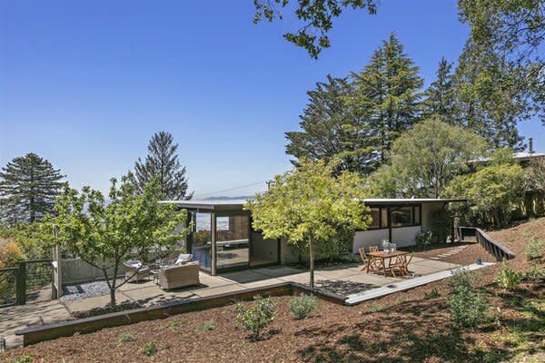 Designed in 1956 by celebrated Chinese American architect Roger Lee, the hillside home sits perched on a spacious, tree-filled lot overlooking the San Francisco Bay.
