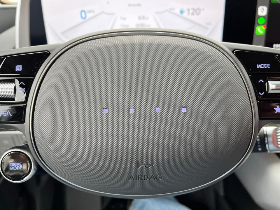 Four LEDs adorn the 2023 Hyundai Ioniq 6 EV's steering wheel where a name or logo is usually seen.