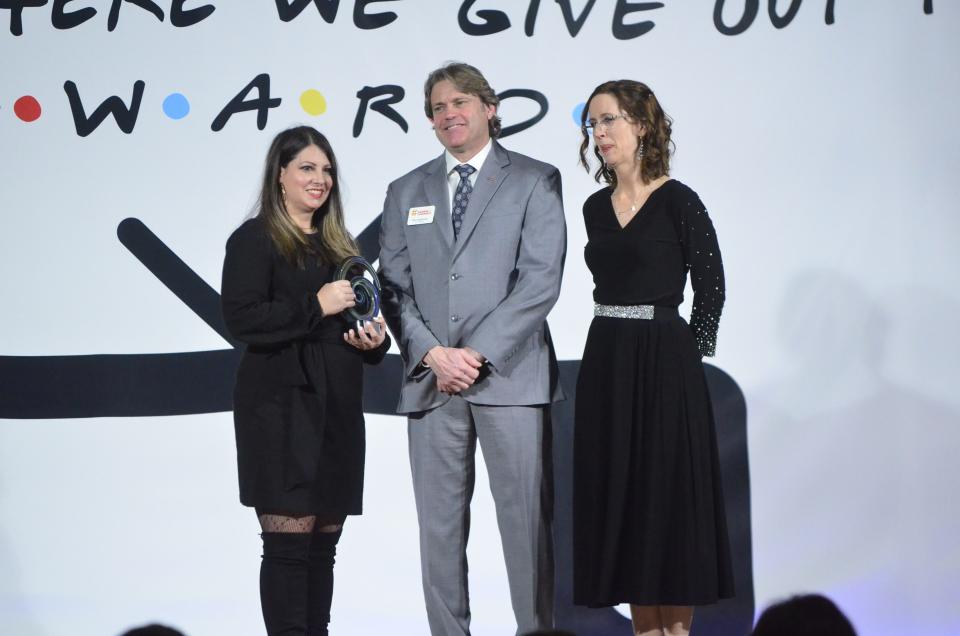 Tara Piatt, owner of Farmers Insurance Tara Piatt Agency, receives the Bob Rosa Buy Local Award from 2024 Chamber Board Chair Ron Holbrook and Chamber President and CEO Melissa Vance during the 2024 Wayne County Area Chamber of Commerce Annual Dinner at First Bank Kuhlman Center, Friday, Jan. 19, 2024.