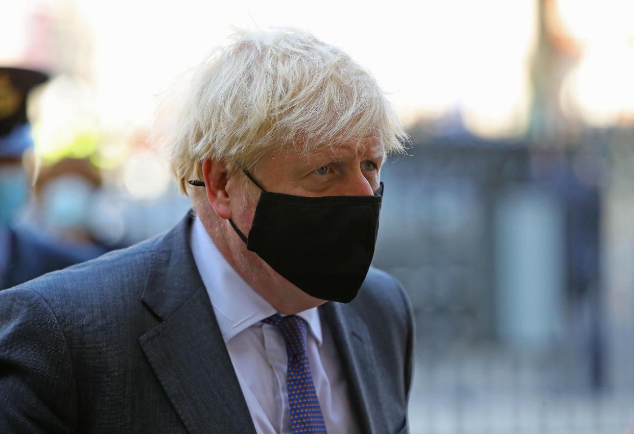 Britain's Prime Minister Boris Johnson wearing a protective face covering, arrives to attend a service marking the 80th anniversary of the Battle of Britain at Westminster Abbey in central London on September 20, 2020. - Westminster Abbey has played a central role in remembering the sacrifice of those who fought in the battle, holding a Service of Thanksgiving and Rededication on Battle of Britain Sunday every year since 1944. (Photo by Aaron Chown / POOL / AFP) (Photo by AARON CHOWN/POOL/AFP via Getty Images)