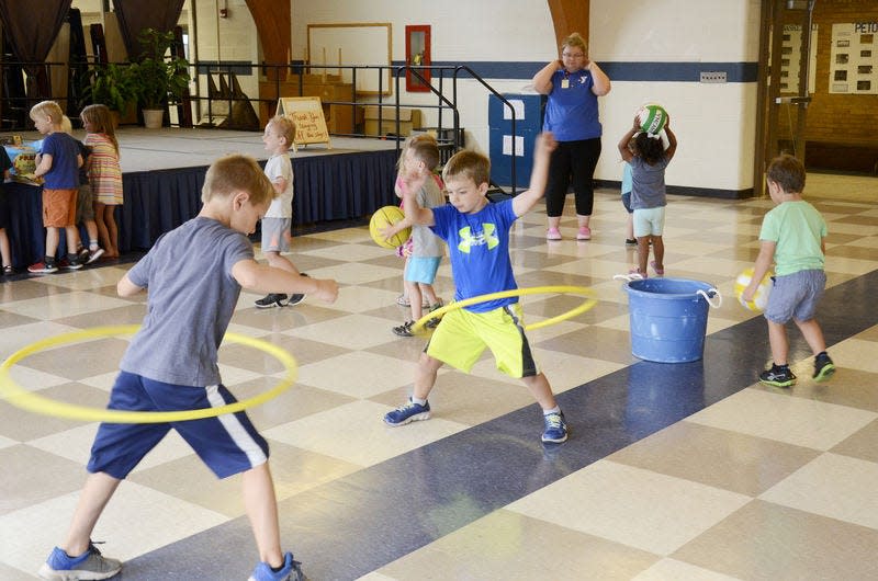Children play games with Kelly Belski during summer camp at Central Elementary School.