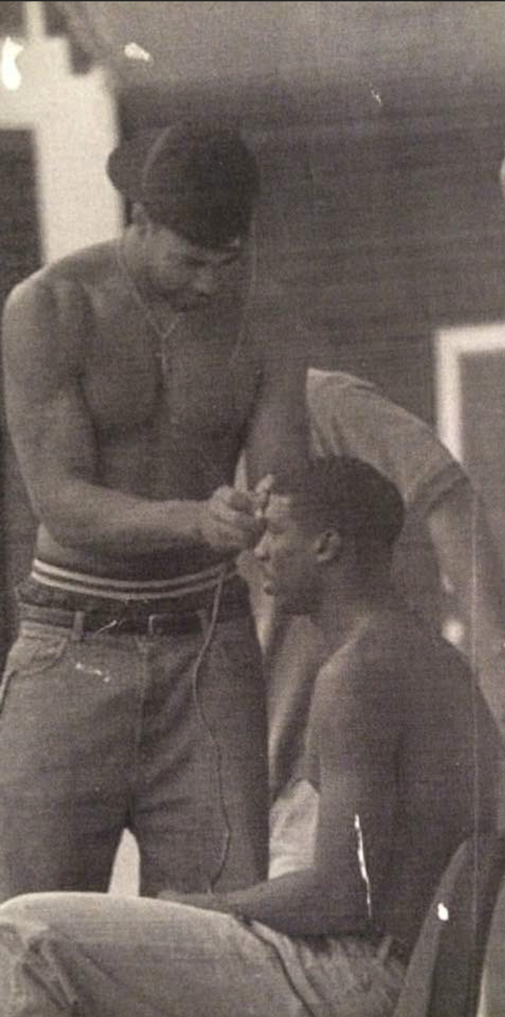 Stonybrook Middle School Principal Jason Smith cuts a teammate's hair at Campbell University in North Carolina.