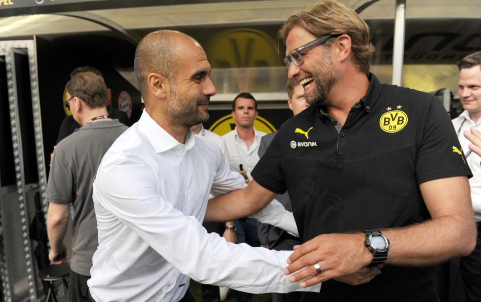 Pep Guardiola and Jurgen Klopp greet each other