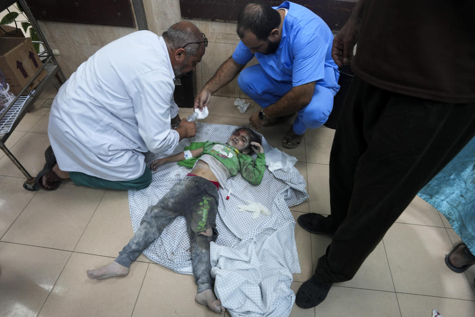 Palestinian child wounded in the Israeli bombardment of the Gaza Strip is treated in al Aqsa Hospital in Deir al Balah on Tuesday, Oct. 31, 2023. (AP Photo/Adel Hana)