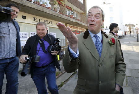 Nigel Farage, leader of the United Kingdom Independence Party (UKIP), leaves after voting at his polling station in Ramsgate, southeast England, May 7, 2015. REUTERS/Suzanne Plunkett