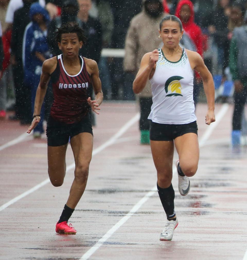 Alexis Donovan of Saint Mark's (right) runs with Hodgson's Savannah Richards before Donovan won the Division II 100 meter race during the second day of the DIAA state high school track and field championships at Dover High School, Saturday, May 18, 2024.