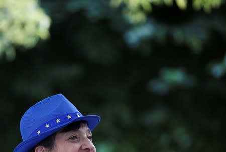 A woman is seen outside the Houses of Parliament in London