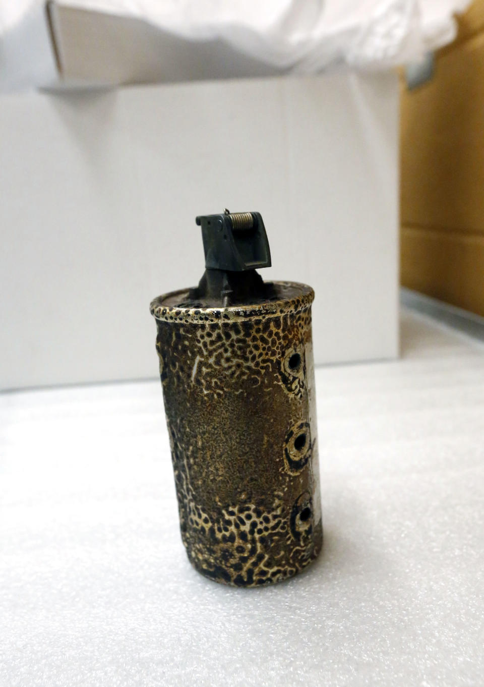 In this Oct. 11, 2013 photograph, a spent tear gas grenade used by U.S. Marshals to try to quell the 1962 riot at the University of Mississippi campus over the registration of James Meredith, a black man, as a student, will be among the items that will eventually be displayed in the civil rights museum in Jackson, Miss. Officials say they did not set out to have separate-but-equal museums for the documentation of the state's history, but it could end up that way. Mississippi breaks ground Thursday. Oct. 24, 2013, on side-by-side museums that are expected to break ground of their own in how they depict the Southern state once rocked by racial turmoil. (AP Photo/Rogelio V. Solis)