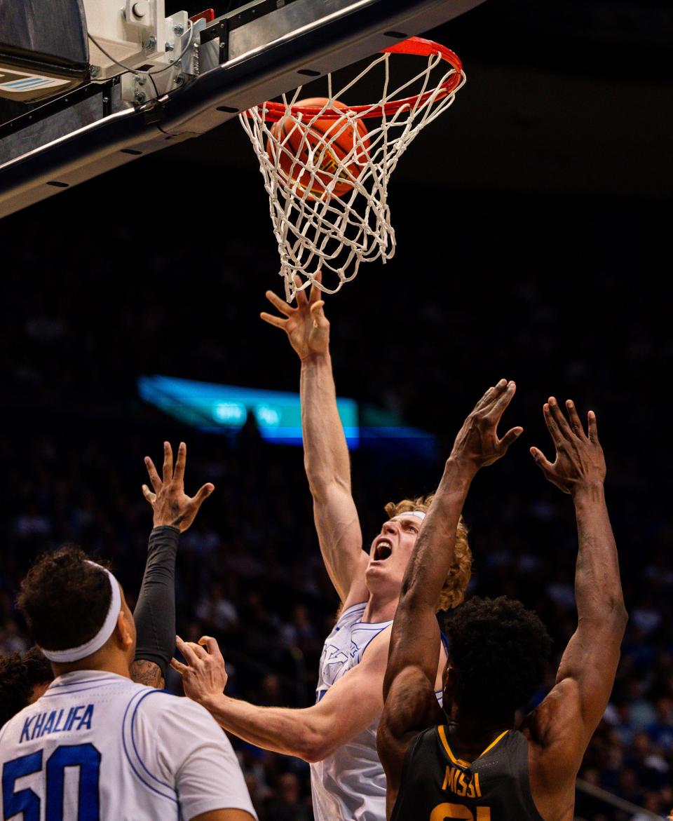 Brigham Young Cougars guard Richie Saunders (15) shoots the ball with Baylor Bears center Yves Missi (21) on defense during a men’s college basketball game between Brigham Young University and Baylor University at the Marriott Center in Provo on Tuesday, Feb. 20, 2024. | Megan Nielsen, Deseret News