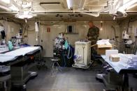 U.S. Army Major Maan works in the operating room at a military field hospital for non-coronavirus patients inside CenturyLink Field Event Center during the coronavirus disease (COVID-19) outbreak in Seattle