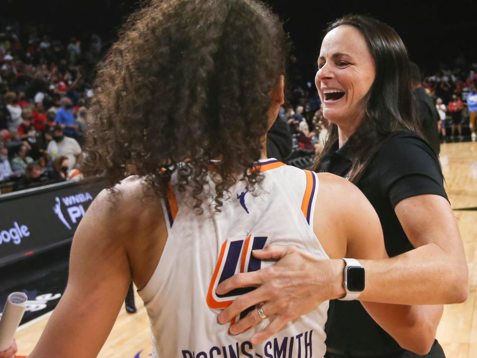 Sandy Brondello (right) hugs Skylar Diggins-Smith after a 2021 playoff victory.