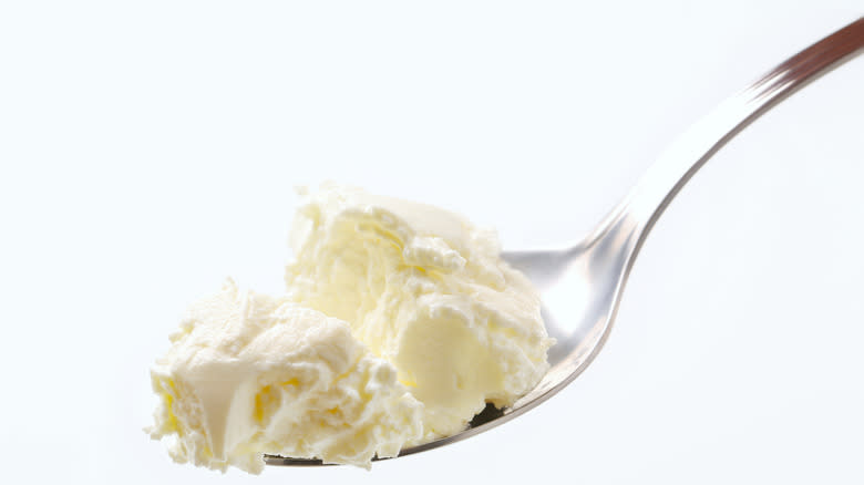 Cream cheese in spoon