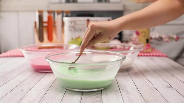 Colouring kueh lapis batter red and green with food colouring