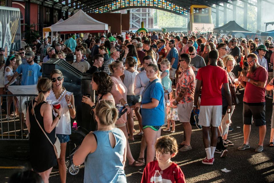 Guests pack the Union Station Train Shed at Hog Days of Summer BBQ and Music Festival in downtown Montgomery.