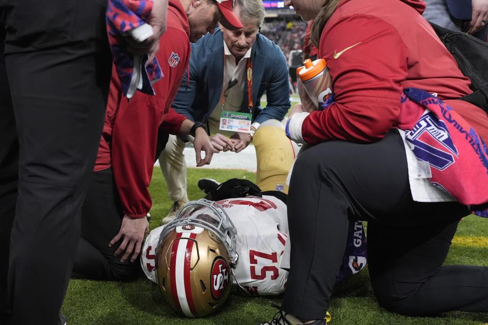 San Francisco 49ers linebacker Dre Greenlaw (57) is helped after an injury against the Kansas City Chiefs during the first half of the NFL Super Bowl 58 football game Sunday, Feb. 11, 2024, in Las Vegas. (AP Photo/George Walker IV)