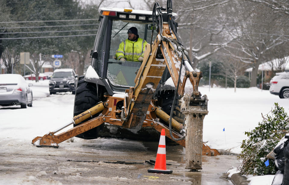 Nathan Bercy, with the City of Richardson water department, begins to open access to make repairs to a water main break due to extreme cold Wednesday, Feb. 17, 2021, in Richardson, Texas. Water service providers in Tennessee, Oklahoma, Texas and other states hit hard by frigid winter storms and mounting power outages are asking residents to restrict usage as reports of water main breaks, low pressure and busted pipes emerge. (AP Photo/LM Otero)