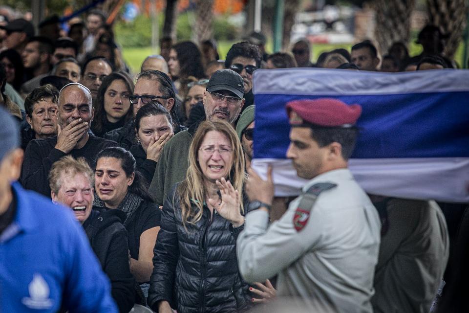 Mourners in Tel Aviv cry on Jan. 23, 2024, during the funeral ceremony for an Israeli soldier killed in Gaza. <a href="https://www.gettyimages.com/detail/news-photo/mourners-cry-during-the-funeral-ceremony-of-major-ilay-levi-news-photo/1948671112?adppopup=true" rel="nofollow noopener" target="_blank" data-ylk="slk:Eyal Warshavsky/SOPA Images/LightRocket via Getty Images;elm:context_link;itc:0;sec:content-canvas" class="link ">Eyal Warshavsky/SOPA Images/LightRocket via Getty Images</a>