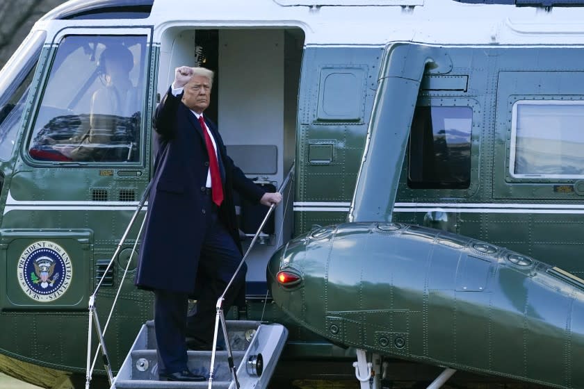 President Donald Trump gestures as he boards Marine One on the South Lawn of the White House, Wednesday, Jan. 20, 2021, in Washington. Trump is en route to his Mar-a-Lago Florida Resort. (AP Photo/Alex Brandon)