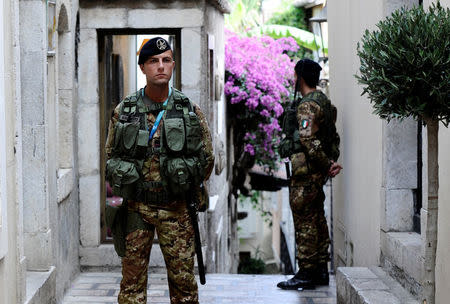 Italian Army soldiers patrol in Taormina where leaders from the world's major Western powers will hold their annual summit, Italy, May 24, 2017. REUTERS/Guglielmo Mangiapane